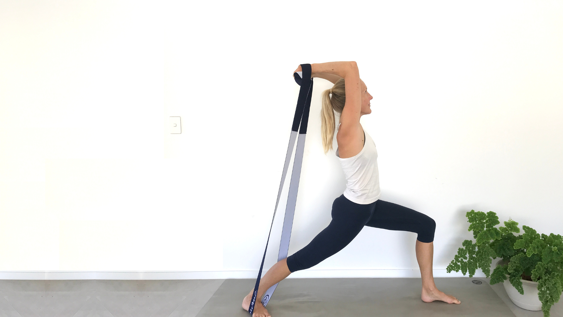 How to practice Yoga's Warrior l Pose with resistance bands to build strength. How to practice Yoga's Warrior l Pose with resistance bands to build strength.