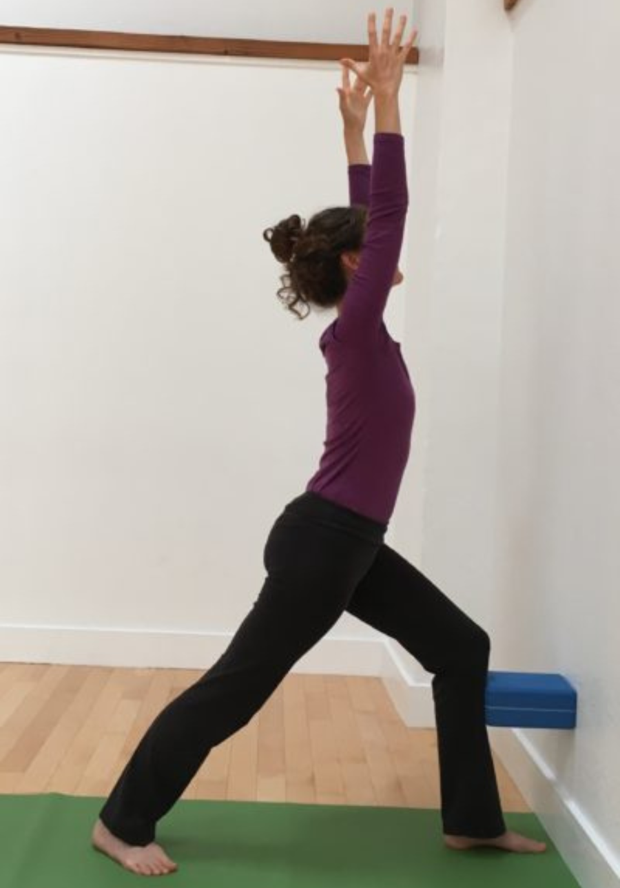 Warrior 1 or Virabhadrasana 1 with backbend at the wall.