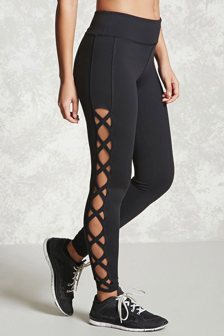 An athletic pair of long stretch-knit leggings featuring crisscross cutouts down...