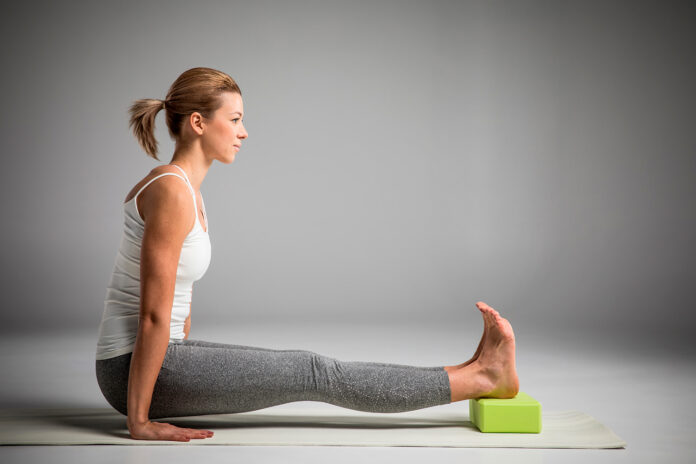 Is sitting on a yoga block good for you?