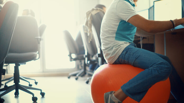 How do you sit on a ball at work?