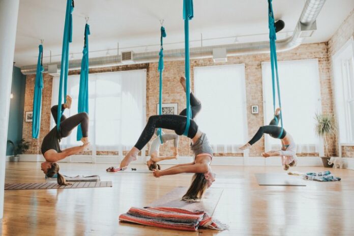 How do you attach aerial yoga to ceiling?