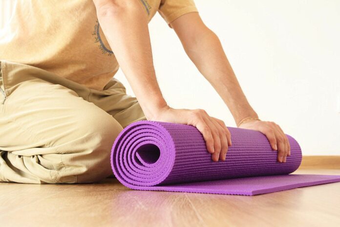How do you clean your yoga mat for the first time?