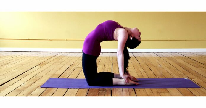 How do you do a downward dog without hurting your wrists?