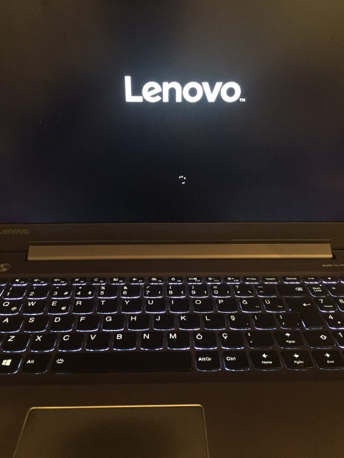 Where is the pinhole reset on my Lenovo Yoga laptop?