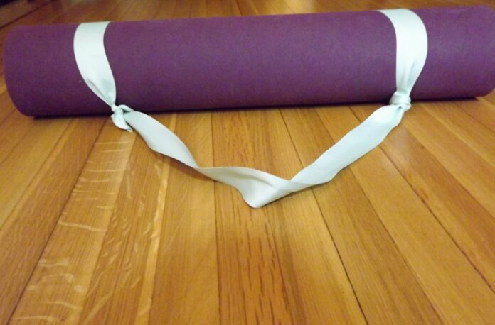 What is the purpose of a yoga strap?