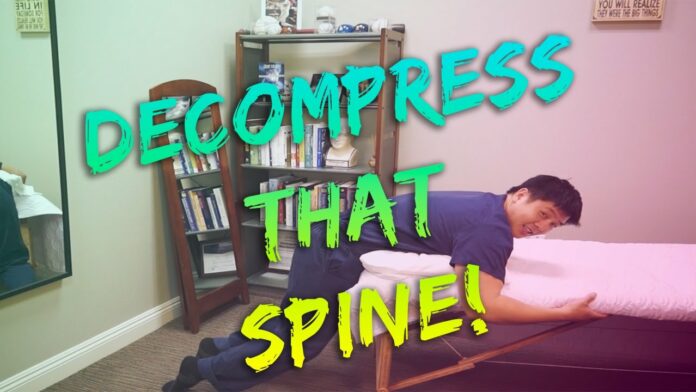 Does laying down decompress your spine?