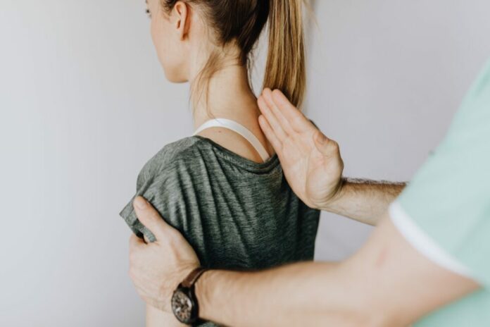 How can I tell if my spine is out of alignment?