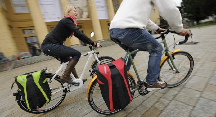 How do you ride a bike with a bag?