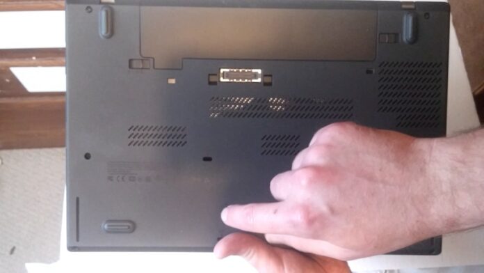 Where is reset button on Lenovo laptop?